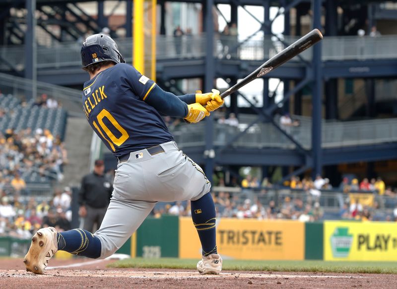May 25, 2025; Pittsburgh, Pennsylvania, USA;  Milwaukee Brewers right fielder Sal Frelick (10) hits an RBI single against the Pittsburgh Pirates during the first inning at PNC Park. Mandatory Credit: Charles LeClaire-Imagn Images