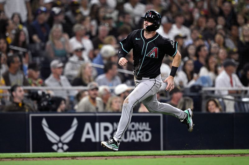 Jul 6, 2024; San Diego, California, USA; Arizona Diamondbacks second baseman Kevin Newman (18) advances home to score a run against the San Diego Padres during the seventh inning at Petco Park. Mandatory Credit: Orlando Ramirez-USA TODAY Sports