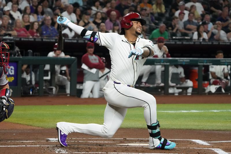 Jul 8, 2024; Phoenix, Arizona, USA; Arizona Diamondbacks second baseman Ketel Marte (4) reacts after missing a pitch against the Atlanta Braves in the first inning at Chase Field. Mandatory Credit: Rick Scuteri-USA TODAY Sports