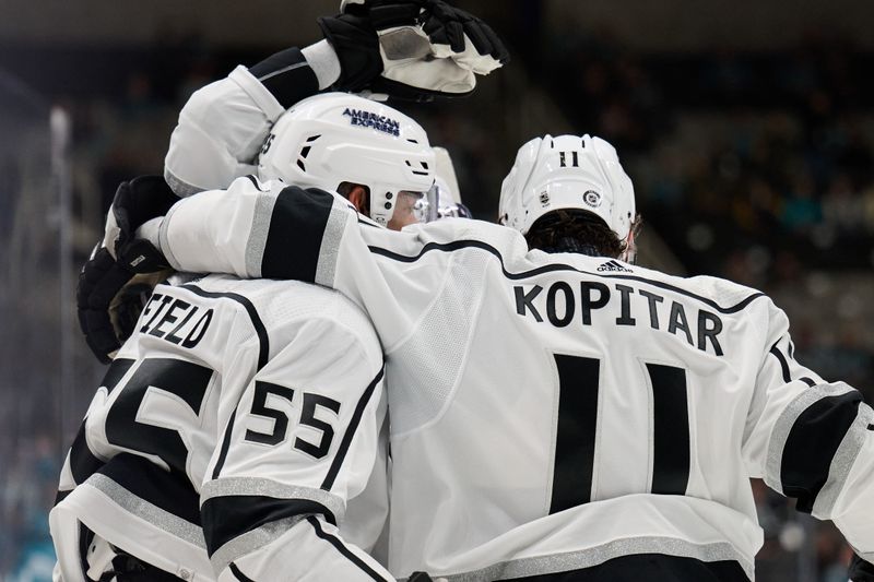 Apr 4, 2024; San Jose, California, USA; Los Angeles Kings center Anze Kopitar (11) and right wing Quinton Byfield (55) celebrate after a goal scored against the San Jose Sharks during the first period at SAP Center at San Jose. Mandatory Credit: Robert Edwards-USA TODAY Sports