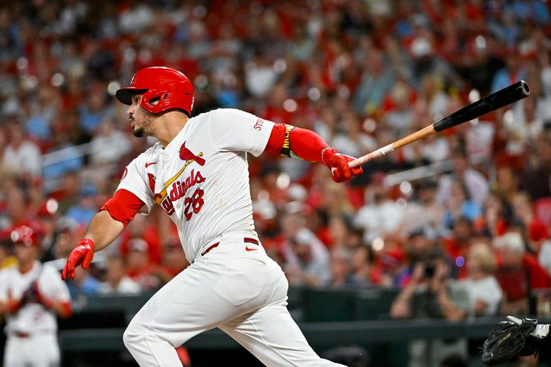 Sep 16, 2024; St. Louis, Missouri, USA;  St. Louis Cardinals third baseman Nolan Arenado (28) hits a one run single against the Pittsburgh Pirates during the fourth inning at Busch Stadium. Mandatory Credit: Jeff Curry-Imagn Images