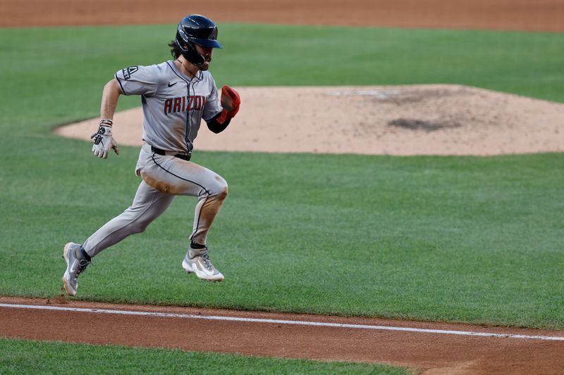 Jun 18, 2024; Washington, District of Columbia, USA; Arizona Diamondbacks outfielder Corbin Carroll (7) scores a run on a sacrifice fly by Diamondbacks second base Ketel Marte (not pictured) against the Washington Nationals during the fifth inning at Nationals Park. Mandatory Credit: Geoff Burke-USA TODAY Sports