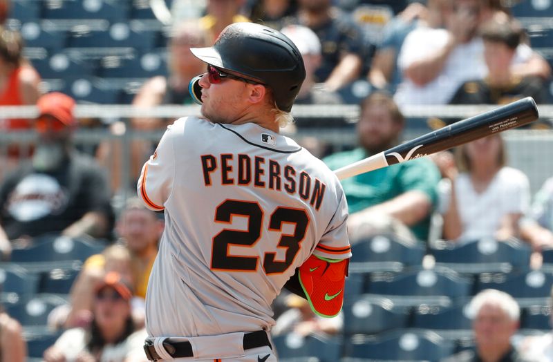 Jul 16, 2023; Pittsburgh, Pennsylvania, USA;  San Francisco Giants designated hitter Joc Pederson (23) drives in a run against the Pittsburgh Pirates during the tenth inning at PNC Park. Mandatory Credit: Charles LeClaire-USA TODAY Sports