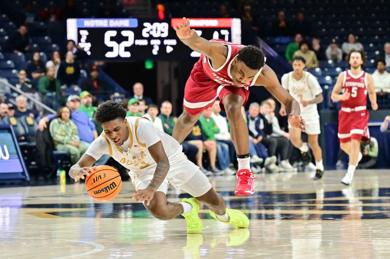 Mar 5, 2025; South Bend, Indiana, USA; Notre Dame Fighting Irish guard Markus Burton (3) and Stanford Cardinal guard Jaylen Blakes (21) reach for a loose ball in the second half at the Purcell Pavilion. Mandatory Credit: Matt Cashore-Imagn Images