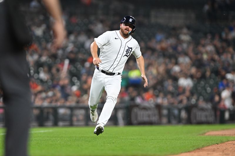 Aug 9, 2023; Detroit, Michigan, USA;  Detroit Tigers pinch runner Jake Rogers (34) runs home to score against the Minnesota Twins in the seventh inning at Comerica Park. Mandatory Credit: Lon Horwedel-USA TODAY Sports