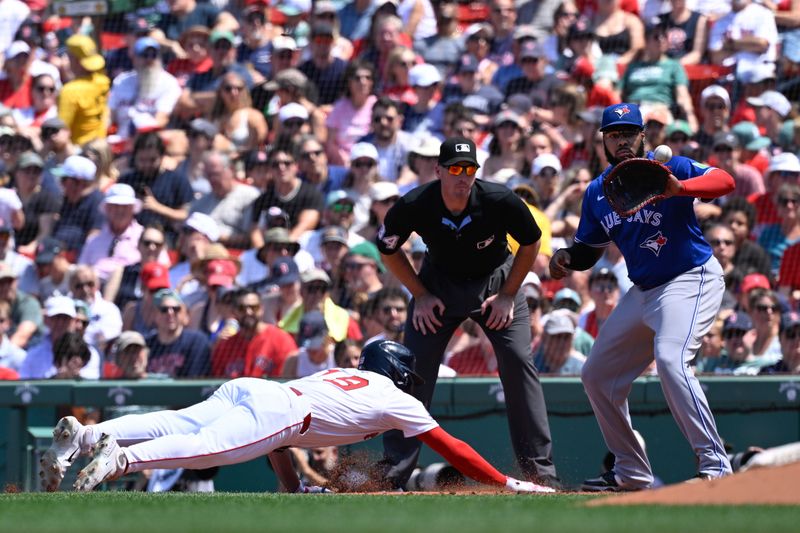 Jun 29, 2025; Boston, Massachusetts, USA; Boston Red Sox right fielder Roman Anthony (19) dives back to first base against Toronto Blue Jays first baseman Vladimir Guerrero Jr. (27) during the third inning at Fenway Park. Mandatory Credit: Eric Canha-Imagn Images