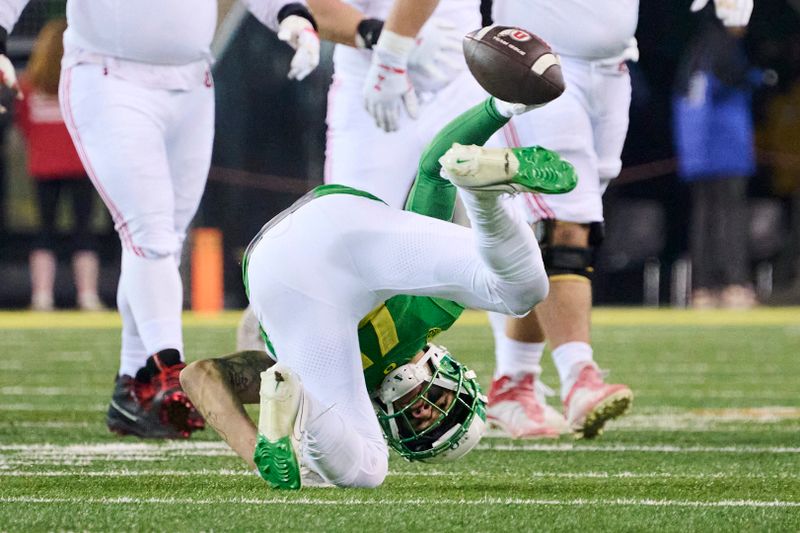 Nov 19, 2022; Eugene, Oregon, USA; Oregon Ducks defensive back Bennett Williams (4) intercepts a pass during the second half against the Utah Utes at Autzen Stadium. The Ducks won the game 20-17. Mandatory Credit: Troy Wayrynen-USA TODAY Sports