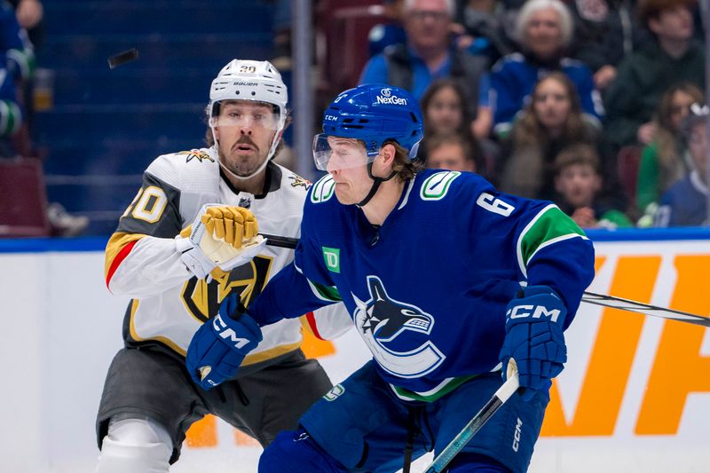 Apr 8, 2024; Vancouver, British Columbia, CAN; Vancouver Canucks forward Brock Boeser (6) battles for the puck with Vegas Golden Knights forward Chandler Stephenson (20) in the second period  at Rogers Arena. Mandatory Credit: Bob Frid-USA TODAY Sports