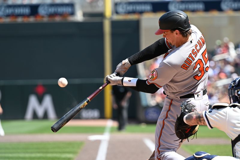 Jul 9, 2023; Minneapolis, Minnesota, USA; Baltimore Orioles catcher Adley Rutschman (35) swings at a pitch against the Minnesota Twins during the sixth inning at Target Field. Mandatory Credit: Jeffrey Becker-USA TODAY Sports