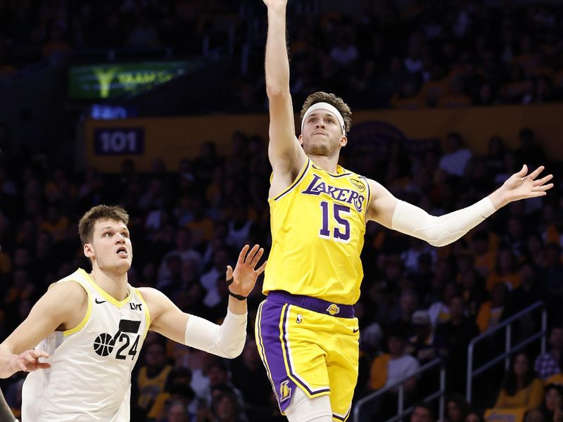 LOS ANGELES, CALIFORNIA - FEBRUARY 10: Austin Reaves #15 of the Los Angeles Lakers shoots the ball over Walker Kessler #24 of the Utah Jazz during the second quarter at Crypto.com Arena on February 10, 2025 in Los Angeles, California.  NOTE TO USER: User expressly acknowledges and agrees that, by downloading and or using this photograph, User is consenting to the terms and conditions of the Getty Images License Agreement. (Photo by Ronald Martinez/Getty Images)