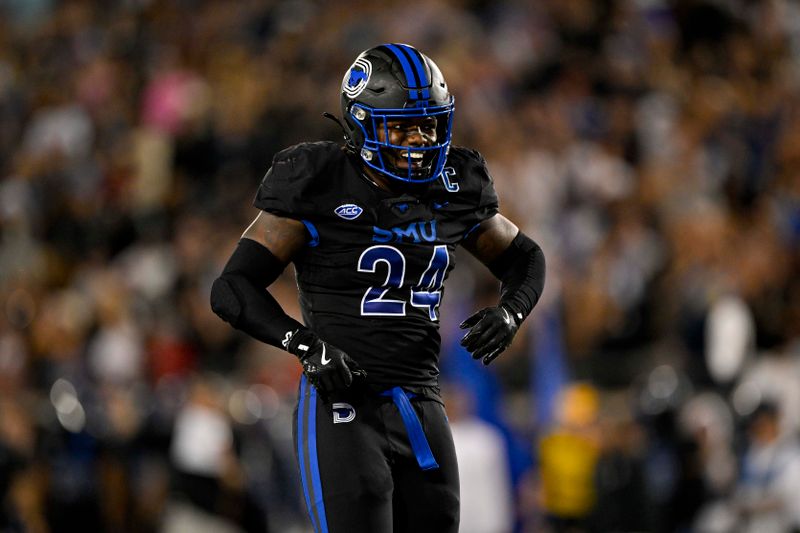 Nov 16, 2024; Dallas, Texas, USA; SMU Mustangs linebacker Kobe Wilson (24) celebrates after he makes a save against the Boston College Eagles during the second half at Gerald J. Ford Stadium. Mandatory Credit: Jerome Miron-Imagn Images