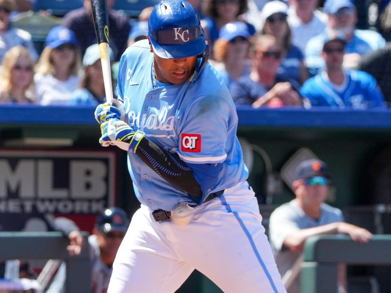 May 22, 2024; Kansas City, Missouri, USA; Kansas City Royals designated hitter Salvador Perez (13) is hit by a pitch against the Detroit Tigers in the seventh inning at Kauffman Stadium. Mandatory Credit: Denny Medley-USA TODAY Sports