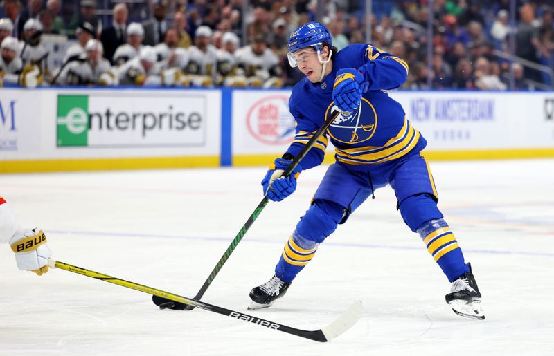Mar 15, 2025; Buffalo, New York, USA;  Buffalo Sabres right wing Jack Quinn (22) takes a shot on goal during the second period against the Vegas Golden Knights at KeyBank Center. Mandatory Credit: Timothy T. Ludwig-Imagn Images