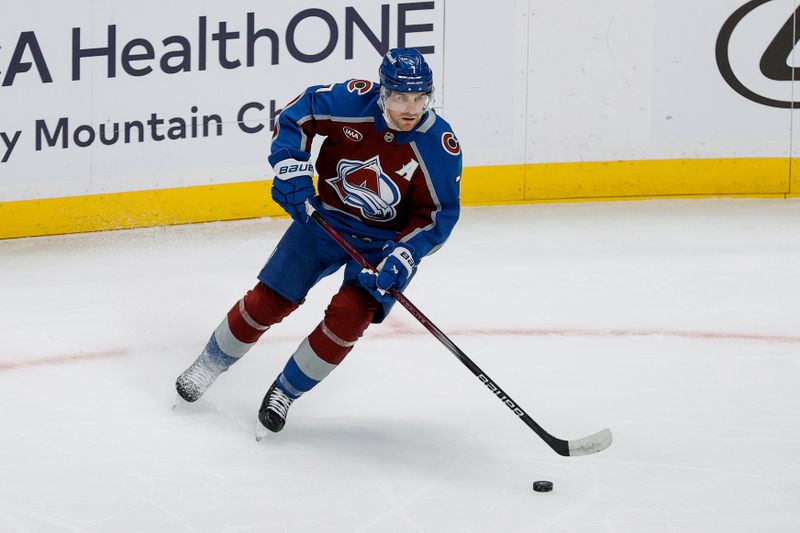 Feb 26, 2025; Denver, Colorado, USA; Colorado Avalanche defenseman Devon Toews (7) controls the puck in the second period against the New Jersey Devils at Ball Arena. Mandatory Credit: Isaiah J. Downing-Imagn Images