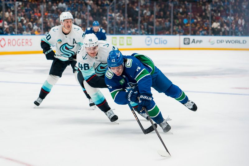 Sep 26, 2025; Vancouver, British Columbia, CAN; Vancouver Canucks defenseman Quinn Hughes (43) drives past Seattle Kraken defenseman Ville Ottavainen (46) in the third period at Rogers Arena. Mandatory Credit: Bob Frid-Imagn Images