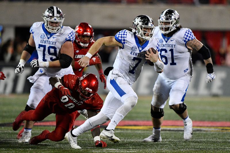 Nov 27, 2021; Louisville, Kentucky, USA;  Kentucky Wildcats quarterback Will Levis (7) runs the ball against Louisville Cardinals defensive lineman Jacquies Turner (90) during the second half at Cardinal Stadium. Kentucky defeated Louisville 52-21. Mandatory Credit: Jamie Rhodes-USA TODAY Sports