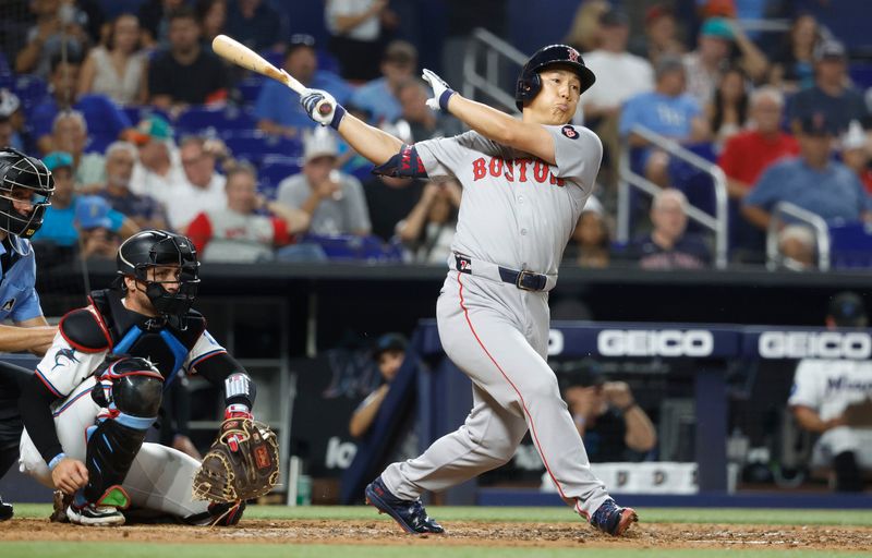 Jul 2, 2024; Miami, Florida, USA;  Boston Red Sox left fielder Masataka Yoshida (7) singles against the Miami Marlins in the seventh inning at loanDepot Park. Mandatory Credit: Rhona Wise-USA TODAY Sports