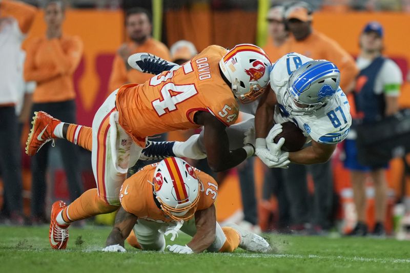 Detroit Lions tight end Sam LaPorta (87) gets leveled by Tampa Bay Buccaneers linebacker Lavonte David (54) during an NFL football game, Sunday, Oct. 15 2023, in Tampa, Fla. (AP Photo/Peter Joneleit)