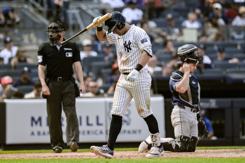 Jul 21, 2024; Bronx, New York, USA; New York Yankees shortstop Anthony Volpe (11) reacts after striking out against the Tampa Bay Rays during the eighth inning at Yankee Stadium. Mandatory Credit: John Jones-USA TODAY Sports