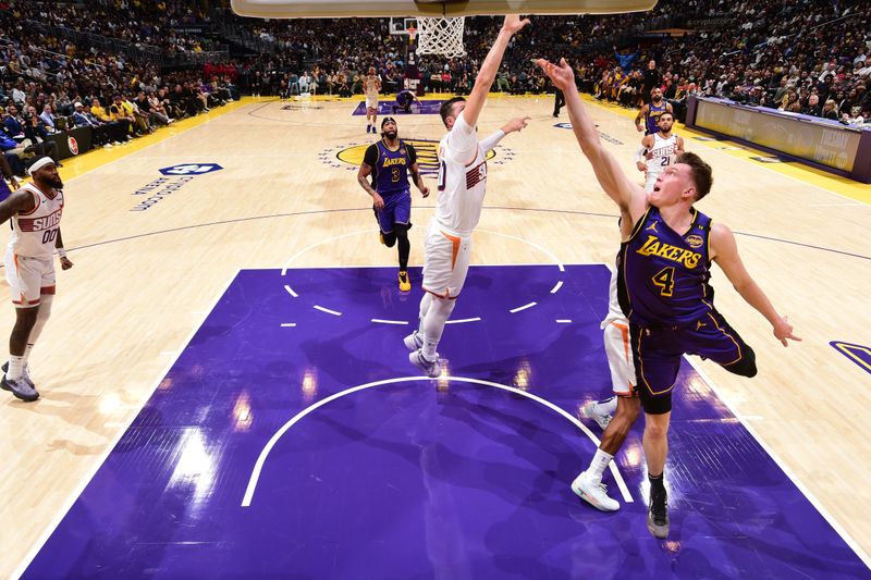 LOS ANGELES, CA - OCTOBER 25: Dalton Knecht #4 of the Los Angeles Lakers shoots the ball during the game against the Phoenix Suns on October 25, 2024 at Crypto.Com Arena in Los Angeles, California. NOTE TO USER: User expressly acknowledges and agrees that, by downloading and/or using this Photograph, user is consenting to the terms and conditions of the Getty Images License Agreement. Mandatory Copyright Notice: Copyright 2024 NBAE (Photo by Adam Pantozzi/NBAE via Getty Images)