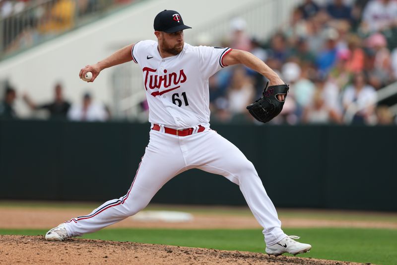 Mar 13, 2023; Fort Myers, Florida, USA;  Minnesota Twins pitcher Brock Stewart (61) throws a pitch against the New York Yankees in the fifth inning during spring training at Hammond Stadium. Mandatory Credit: Nathan Ray Seebeck-USA TODAY Sports