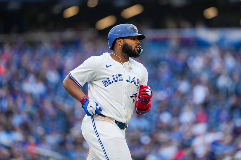 May 15, 2025; Toronto, Ontario, CAN; Toronto Blue Jays first base Vladimir Guerrero Jr. (27) runs to first base against the Tampa Bay Rays during the eighth inning at Rogers Centre. Mandatory Credit: Kevin Sousa-Imagn Images