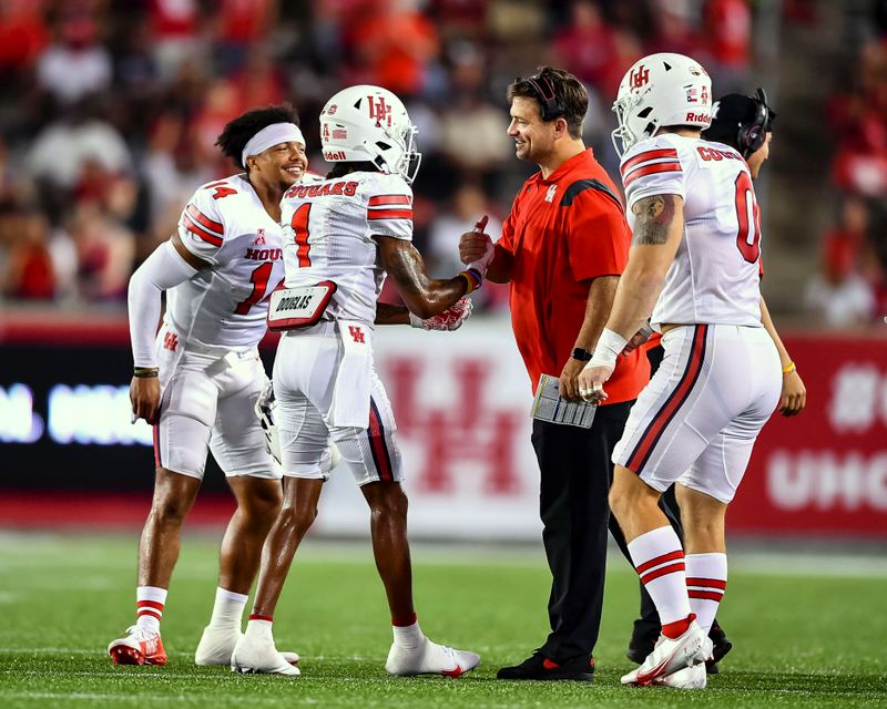 Sep 18, 2021; Houston, Texas, USA;  Houston Cougars wide receiver Nathaniel Dell (1) celebrates with teammates after scoring a touchdown against the Grambling State Tigers during the third quarter at TDECU Stadium. Mandatory Credit: Maria Lysaker-USA TODAY Sports