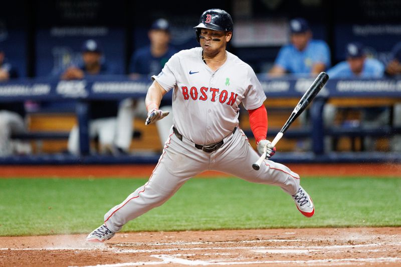 May 22, 2024; St. Petersburg, Florida, USA;  Boston Red Sox third baseman Rafael Devers (11) takes a pitch inside against the Tampa Bay Rays in the fourth inning at Tropicana Field. Mandatory Credit: Nathan Ray Seebeck-USA TODAY Sports