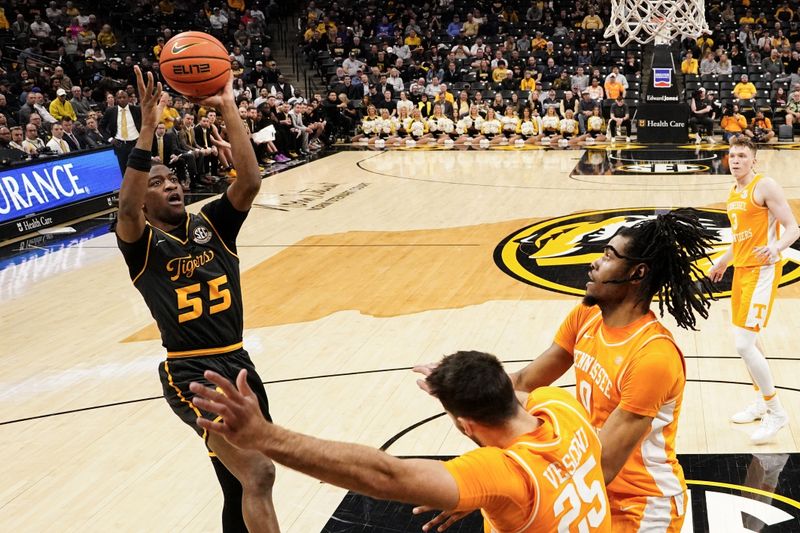 Feb 20, 2024; Columbia, Missouri, USA; Missouri Tigers guard Sean East II (55) shoots as Tennessee Volunteers forward Jonas Aidoo (0) defends during the first half at Mizzou Arena. Mandatory Credit: Denny Medley-USA TODAY Sports