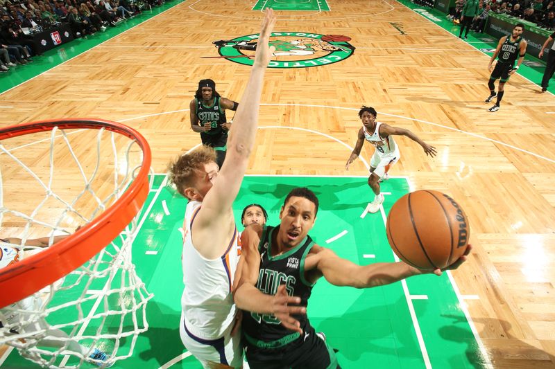 BOSTON, MA - FEBRUARY 3: Malcolm Brogdon #13 of the Boston Celtics drives to the basket during the game against the Phoenix Suns on February 3, 2023 at TD Garden in Boston, Massachusetts.  NOTE TO USER: User expressly acknowledges and agrees that, by downloading and or using this photograph, User is consenting to the terms and conditions of the Getty Images License Agreement. Mandatory Copyright Notice: Copyright 2022 NBAE  (Photo by Nathaniel S. Butler/NBAE via Getty Images)