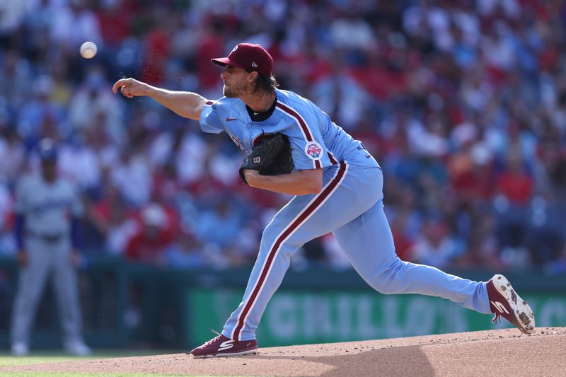 Jul 11, 2024; Philadelphia, Pennsylvania, USA; Philadelphia Phillies pitcher Aaron Nola (27) throws a pitch during the first inning against the Los Angeles Dodgers at Citizens Bank Park. Mandatory Credit: Bill Streicher-USA TODAY Sports