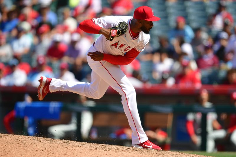 May 1, 2024; Anaheim, California, USA; Los Angeles Angels relief pitcher Amir Garrett (32) throws against the Philadelphia Phillies during the seventh inning at Angel Stadium. Mandatory Credit: Gary A. Vasquez-USA TODAY Sports