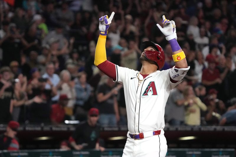 May 6, 2025; Phoenix, Arizona, USA; Arizona Diamondbacks outfielder Lourdes Gurriel Jr. (12) reacts after hitting a two run home run against the New York Mets in the sixth inning at Chase Field. Mandatory Credit: Rick Scuteri-Imagn Images