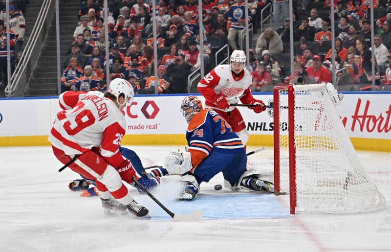 Dec 11, 2025; Edmonton, Alberta, CAN; Detroit Red Wings center Nate Danielson (29) tries to get the puck past Edmonton Oilers goalie Stuart Skinner (74) during the second period at Rogers Place. Mandatory Credit: Walter Tychnowicz-Imagn Images