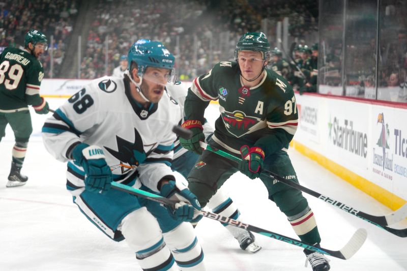 Mar 3, 2024; Saint Paul, Minnesota, USA; Minnesota Wild left wing Kirill Kaprizov (97) looks to check San Jose Sharks center Mike Hoffman (68) in the first period at Xcel Energy Center. Mandatory Credit: Matt Blewett-USA TODAY Sports