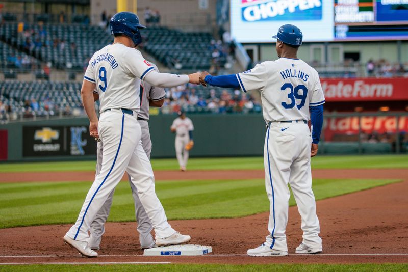 Apr 10, 2024; Kansas City, Missouri, USA; Kansas City Royals first base Vinnie Pasquantino (9) fist bumps Kansas City Royals first base coach Damon Hollins (39) after a walk during the first inning against the Houston Astros at Kauffman Stadium. Mandatory Credit: William Purnell-USA TODAY Sports