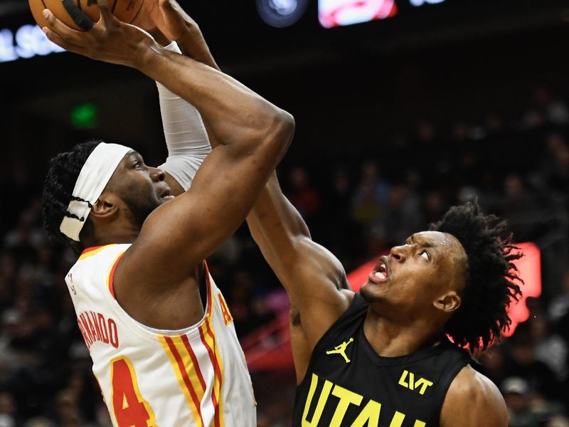 SALT LAKE CITY, UTAH - MARCH 15: Bruno Fernando #24 of the Atlanta Hawks shoots over Collin Sexton #2 of the Utah Jazz during the first half of a game at Delta Center on March 15, 2024 in Salt Lake City, Utah.  NOTE TO USER: User expressly acknowledges and agrees that, by downloading and or using this photograph, User is consenting to the terms and conditions of the Getty Images License Agreement.  (Photo by Alex Goodlett/Getty Images)