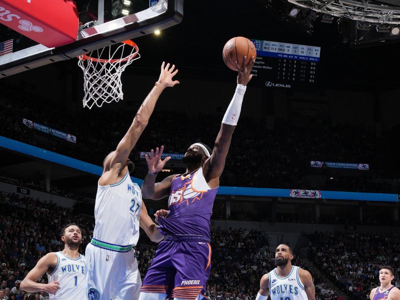 MINNEAPOLIS, MN -  APRIL 14: Royce O'Neale #00 of the Phoenix Suns shoots the ball during the game against the Minnesota Timberwolves on April 14, 2024 at Target Center in Minneapolis, Minnesota. NOTE TO USER: User expressly acknowledges and agrees that, by downloading and or using this Photograph, user is consenting to the terms and conditions of the Getty Images License Agreement. Mandatory Copyright Notice: Copyright 2024 NBAE (Photo by Jordan Johnson/NBAE via Getty Images)