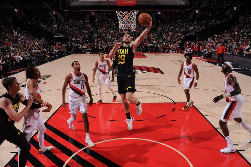 PORTLAND, OR - OCTOBER 18: Svi Mykhailiuk #19 of the Utah Jazz drives to the basket during the game against the Portland Trail Blazers on October 18, 2024 at the Moda Center Arena in Portland, Oregon. NOTE TO USER: User expressly acknowledges and agrees that, by downloading and or using this photograph, user is consenting to the terms and conditions of the Getty Images License Agreement. Mandatory Copyright Notice: Copyright 2024 NBAE (Photo by Cameron Browne/NBAE via Getty Images)