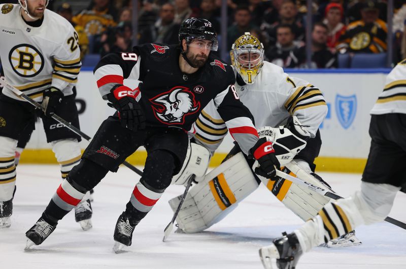 Dec 27, 2023; Buffalo, New York, USA;  Buffalo Sabres right wing Alex Tuch (89) looks for the loose puck during the second period against the Boston Bruins at KeyBank Center. Mandatory Credit: Timothy T. Ludwig-USA TODAY Sports