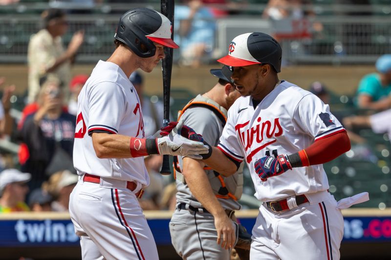 Aug 16, 2023; Minneapolis, Minnesota, USA; Minnesota Twins designated hitter Jorge Polanco (11) celebrates with right fielder Max Kepler (26) after hitting a two run home run against the Detroit Tigers in the ninth inning at Target Field. Mandatory Credit: Jesse Johnson-USA TODAY Sports