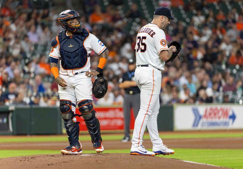 Sep 12, 2023; Houston, Texas, USA; Houston Astros catcher Martin Maldonado (15) visits starting pitcher Justin Verlander (35) on the mound after Verlander gave up a two run home run against the Oakland Athletics in the first inning at Minute Maid Park. Mandatory Credit: Thomas Shea-USA TODAY Sports