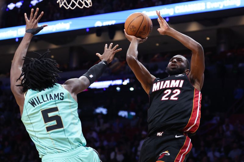 MIAMI, FLORIDA - MARCH 23: Andrew Wiggins #22 of the Miami Heat shoots the ball against Mark Williams #5 of the Charlotte Hornets during the second quarter of the game at Kaseya Center on March 23, 2025 in Miami, Florida. NOTE TO USER: User expressly acknowledges and agrees that, by downloading and or using this photograph, User is consenting to the terms and conditions of the Getty Images License Agreement. (Photo by Megan Briggs/Getty Images)