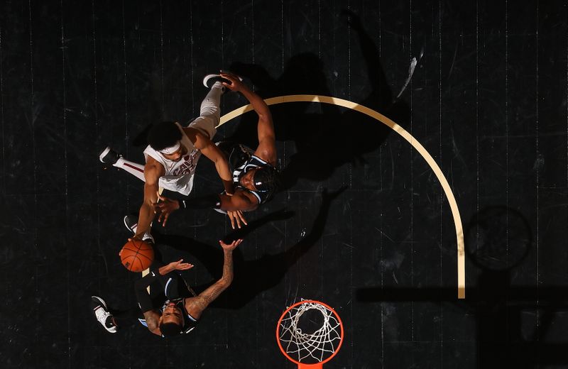 ATLANTA, GEORGIA - MARCH 06:  Jarrett Allen #31 of the Cleveland Cavaliers attacks the basket against Dejounte Murray #5 and Bruno Fernando #24 of the Atlanta Hawks during the fourth quarter at State Farm Arena on March 06, 2024 in Atlanta, Georgia.  NOTE TO USER: User expressly acknowledges and agrees that, by downloading and/or using this photograph, user is consenting to the terms and conditions of the Getty Images License Agreement.  (Photo by Kevin C. Cox/Getty Images)
