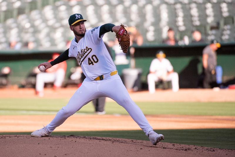 Jul 2, 2024; Oakland, California, USA; Oakland Athletics starting pitcher Mitch Spence (40) pitches against the Los Angeles Angels during the second inning at Oakland-Alameda County Coliseum. Mandatory Credit: Ed Szczepanski-USA TODAY Sports