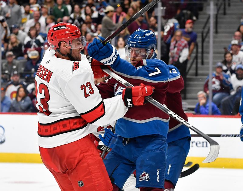 Oct 21, 2023; Denver, Colorado, USA; Carolina Hurricanes right wing Stefan Noesen (23) and Colorado Avalanche defenseman Devon Toews (7) get tangled up during the third period at Ball Arena. Mandatory Credit: John Leyba-USA TODAY Sports