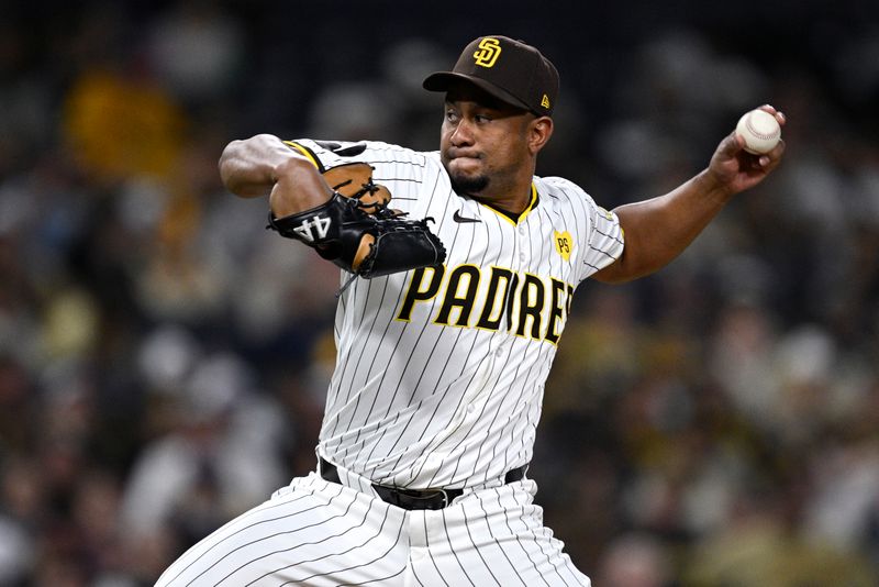 May 13, 2024; San Diego, California, USA; San Diego Padres relief pitcher Wandy Peralta (58) throws a pitch against the Colorado Rockies during the ninth inning at Petco Park. Mandatory Credit: Orlando Ramirez-USA TODAY Sports