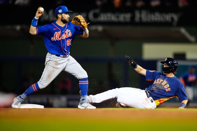 Mar 18, 2023; West Palm Beach, Florida, USA; Houston Astros infielder Grae Kissinger slides into second base as New York Mets second baseman Jose Peraza (81) tags him out during the seventh inning at The Ballpark of the Palm Beaches. Mandatory Credit: Rich Storry-USA TODAY Sports