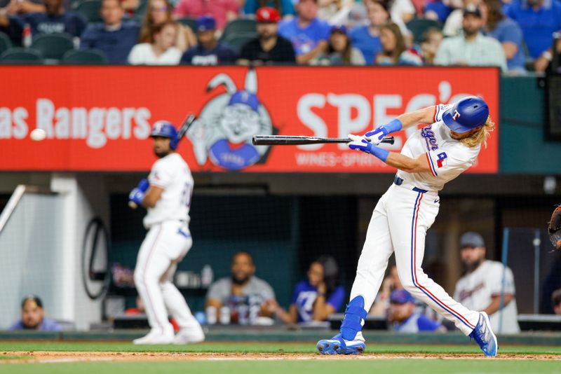 May 15, 2024; Arlington, Texas, USA; Texas Rangers designated hitter Travis Jankowski (16) gets a hit during the sixth inning against the Cleveland Guardians at Globe Life Field. Mandatory Credit: Andrew Dieb-USA TODAY Sports