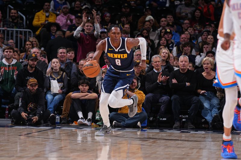 DENVER, CO - NOVEMBER 6: Peyton Watson #8 of the Denver Nuggets dribbles the ball during the game against the Oklahoma City Thunder during a regular season game on November 6, 2024 at Ball Arena in Denver, Colorado. NOTE TO USER: User expressly acknowledges and agrees that, by downloading and/or using this Photograph, user is consenting to the terms and conditions of the Getty Images License Agreement. Mandatory Copyright Notice: Copyright 2024 NBAE (Photo by Bart Young/NBAE via Getty Images)